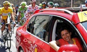 Paris' deputy mayor and socialist candidate to the 2014 municipal elections in Paris Anne Hidalgo (R) is seen in an official vehicle as she attends the 205.5 km seventh stage of the 100th edition of the Tour de France cycling race on July 5, 2013 between Montpellier and Albi, southwestern France.  AFP PHOTO / JOEL SAGETJOEL SAGET/AFP/Getty Images