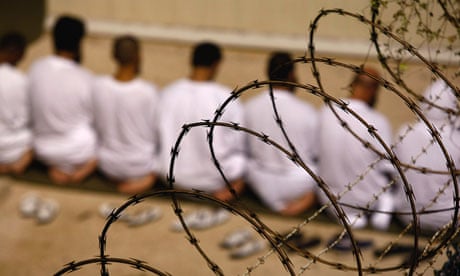 A group of Guantanamo Bay detainees during an early morning Islamic prayer