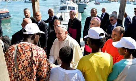 Pope Francis meets a group of immigrants at the pier in Lampedusa, Italy