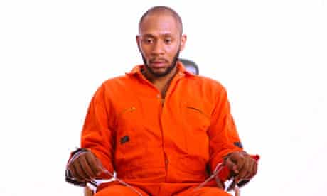 Yasiin Bey being force fed to highlight the force feeding of Guantánamo Bay prisoners.