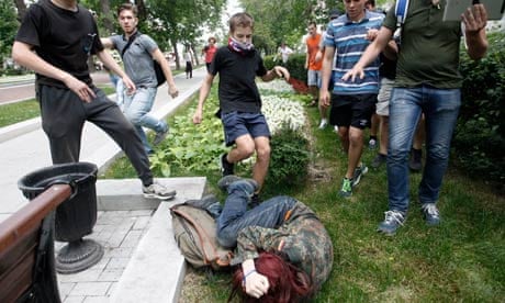 Youths kick gay rights activist during protest
