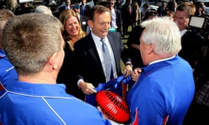 Opposition leader Tony Abbott shares a joke with members of Mernda Football Club on August 16, 2013 in Melbourne, Australia. Abbott and Liberal candidate for McEwen Donna Petrovich announced that if elected the Coalition will provide $2.5 million for the relocation of the Mernda Football Club and other local sporting clubs to new facilities as part of a $9 million project to build new sporting grounds at Woodland Waters.
