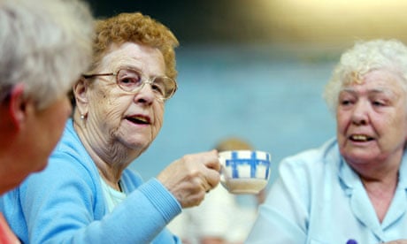 Old lady lifts cup of tea