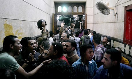 Security forces escort Muslim Brotherhood supporters away from the ­al-Fath mosque