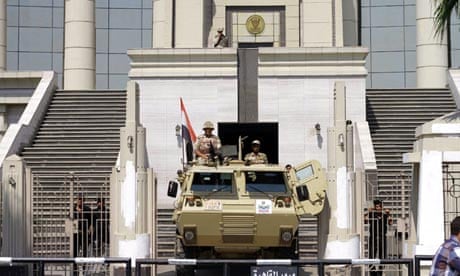An armoured personnel carrier is stationed outside Egypt's constitutional court in Cairo