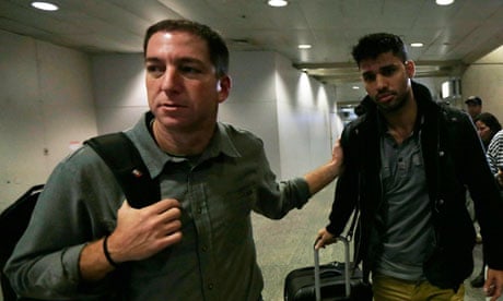 Glen Greenwald walks with his partner, David Miranda in Rio de Janeiro's international airport