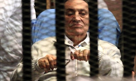 Egypt's ousted President Hosni Mubarak sits inside a dock at the police academy on the outskirts of Cairo, 15 April, 2013.