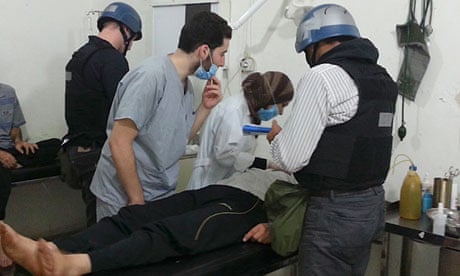 UN chemical weapons experts visit people affected by the apparent gas attack in Damascus suburb