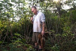 Amazon: Alex Atala holding a manioc root in the Amazon jungle