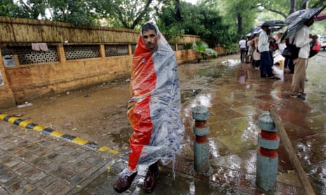 The seasons look for heavy rain in New Delhi, India. Photograph: Harish Tyagi/EPA