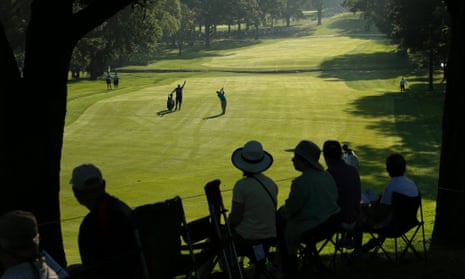 The gallery watches Matt Every hit a stroke on the 13th fairway during the first round of the PGA Championship golf tournament at Oak Hill Country Club, in Pittsford, New York.