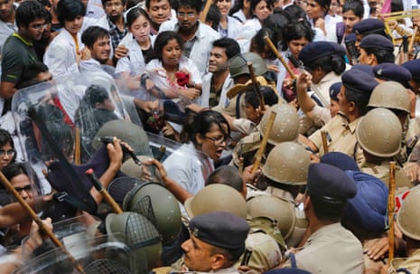 Indian medical students scuffle with police during a protest in New Delhi. Hundreds of medical students were protesting against the compulsory year-long rural posting required by the Indian government, demanding it be made voluntary.