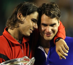Nadal's trophies: 12 Rafael Nadal (L) of Spain embraces Roger Federer