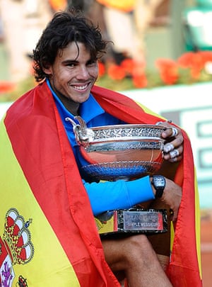 Nadal's trophies: 20 Spain's Rafael Nadal poses with his trophy