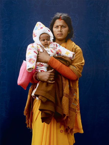 Kumbh Mela pilgrim Mamta Dubey and infant  by Giles Price