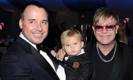 Elton John with his partner David Furnish and their son Zachary, 2012. 