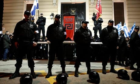 Members of the Golden Dawn party guard a stage during a rally in Athens earlier this year
