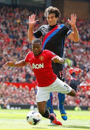 Saturday Roundup: Patrice Evra goes down under a challenge from Palace's Mile Jedinak 