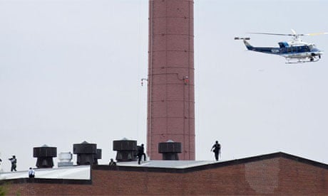Police walk on the roof of Navy Yard