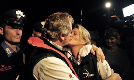 Senior salvage master Nick Sloane kisses his wife after the operation to right the Costa Concordia