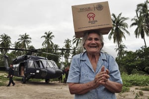 mexico floods: Residents help to unload aid packages