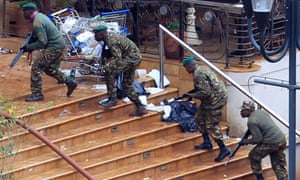 Kenya Defence Forces soldiers take their position at the Westgate shopping centre, on the fourth day since militants stormed into the mall, in Nairobi September 24, 2013.