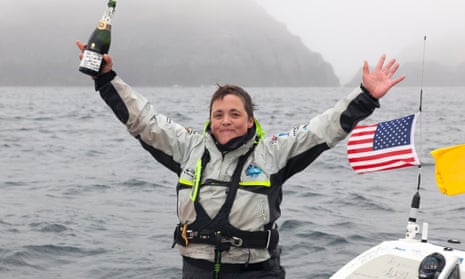 Sarah Outen celebrates after arriving in Adek, Alaska.