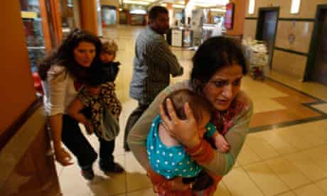 Women carrying children in Westgate shopping centre