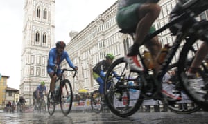 Cyclists ride past Florence's Santa Maria del Fiore Basilica during the men's elite race at the road cycling world championships in Tuscany.