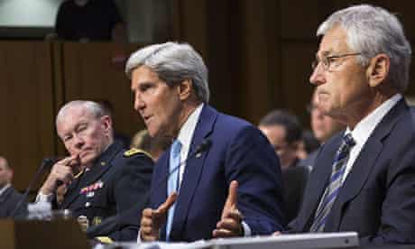 US secretary of state John Kerry, flanked by General Martin Dempsey and Chuck Hagel