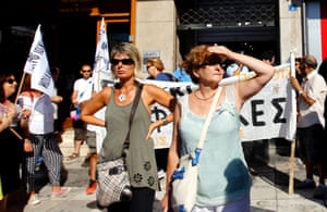 School guards take over the entrance of the building of the Interior Ministry, protesting against a mobility scheme for public servants, in Athens, Greece, 04 September 2013.