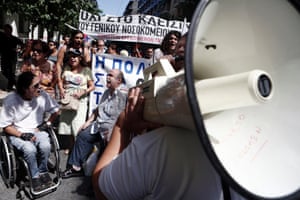 People with disabilities take part in a rally organised by medical workers against the government's plans to overhaul the health system outside the Health Ministry in Athens September 4, 2013.