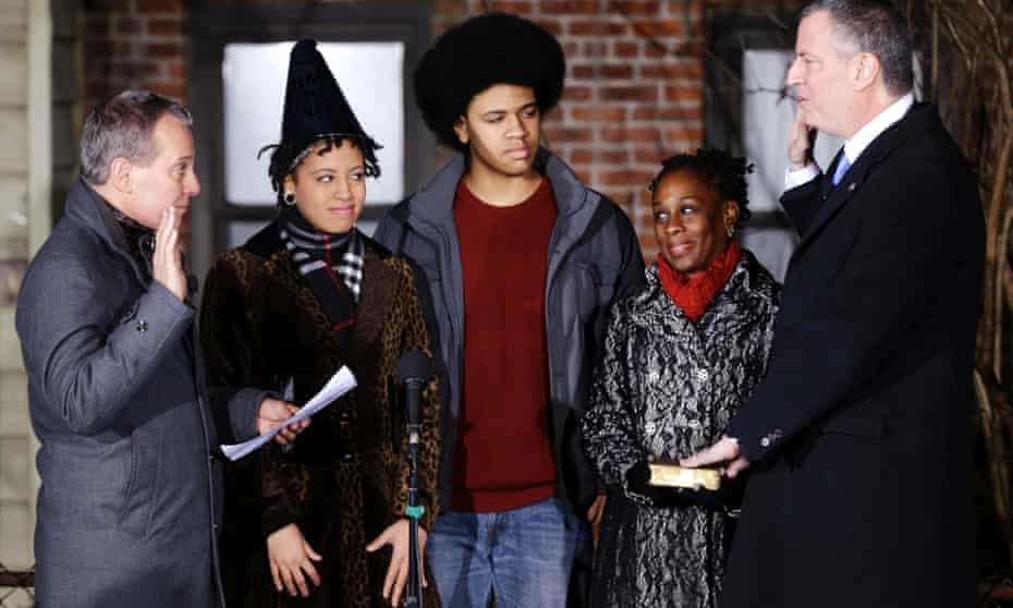 Bill de Blasio, right, watched by his children Chiara and Dante and wife Chirlane McCray, is sworn in as mayor of New York City by state attorney general Eric Schneiderman in the first moments of 2014.