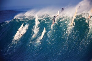 Incredible waves: Surfers at Waimea Bay in Hawaii 