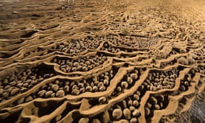 Thousands of "cave pearls" sit untouched in Son Doong. The natural phenomenon occurs over hundreds of years when dripping water creates layers of calcite that build up around grains of sand.