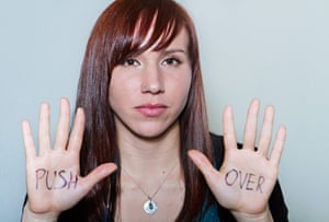 Big Picture - What I Be: young woman with the words 'push over' written on palms of hands
