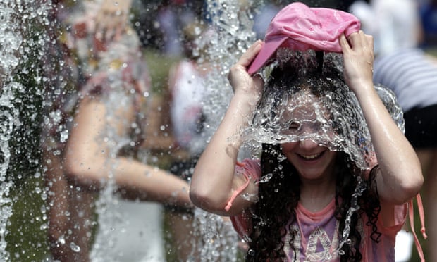 A tennis fan cools off at the Australian Open tennis tournament in Melbourne.
