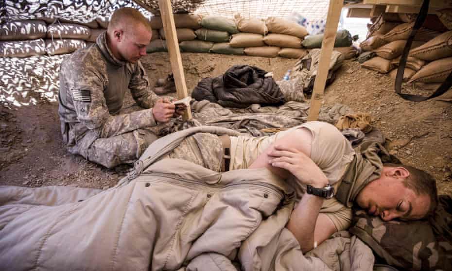 Bowe Bergdahl (sitting) at an observation post near Malakh, Afghanistan, in 2009, when he was part of a team building a base for the Afghan army.