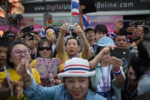 Weekend in pictures: Bangkok, Thailand: An anti-government protestor takes a photograph of Thai 