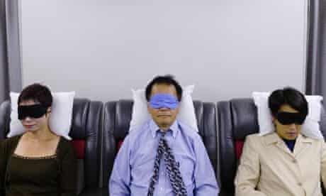 Passengers asleep on a plane