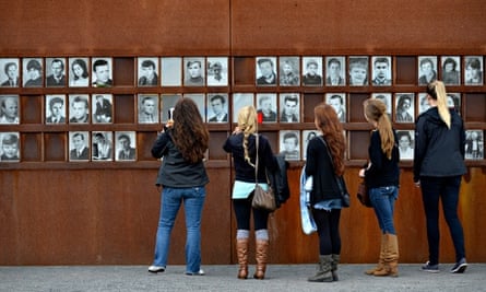 Visitors in front of photos of victims of the Berlin Wall, Berlin Wall Memorial