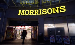 Morrisons suffered falling underlying sales over Christmas as shoppers went online and turned to value chains Aldi and Lidl.