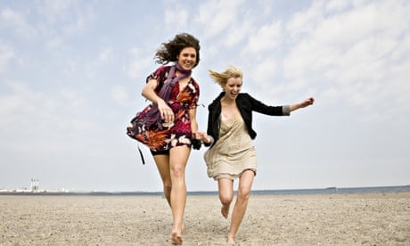 Two women running on the beach, Amager Strandpark, Copenhagen, Denmark