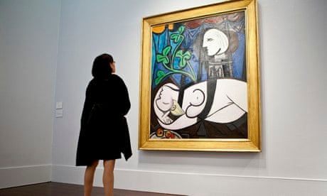 A woman looking at a Picasso painting