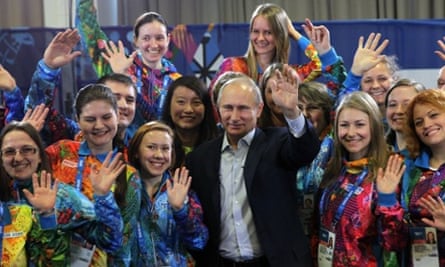 Vladimir Putin poses with Sochi Winter Olympics 2014 volunteers. It's not often that he's the most stylish person in a room.