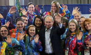 Vladimir Putin poses with Sochi Winter Olympics 2014 volunteers. It's not often that he's the most stylish person in a room.