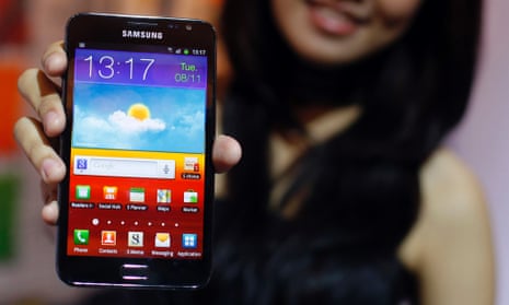 Woman holding Samsung Android smartphone