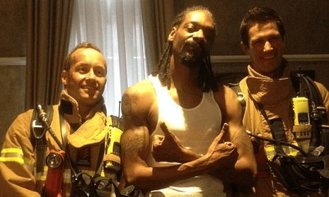 Snoop Dogg with Melbourne firefighters after smoke from his hotel room set off a fire alarm