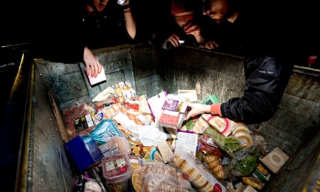 Freegans reclaiming food at night from bins outside a supermarket in Scotland