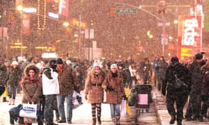 Visitors enjoy the snow on Broadway, Times Square, in New York